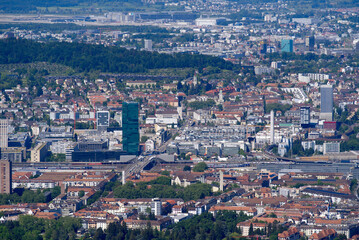 Fototapeta na wymiar Aerial view of City of Zürich seen from local mountain Uetliberg on a sunny spring day. Photo taken May 18th, 2022, Zurich, Switzerland.