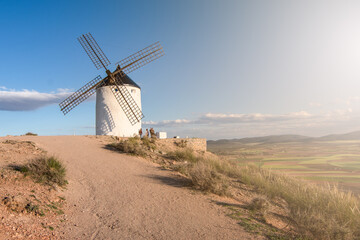 Windmills of Consuegra in the province of Toledo during a sunset with a clear summer day
