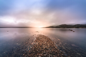 Fototapeta premium Winter sunrise at Manzanares el Real (Madrid), Santillana Reservoir