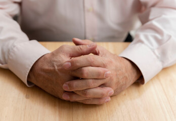 close-up of older male hands ,elderly solitude concept