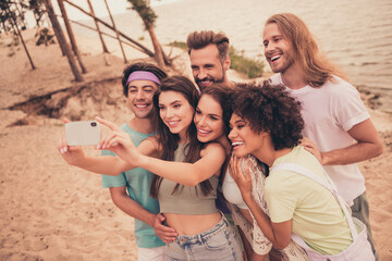 Portrait of attractive cheerful group spending free time taking making selfie having fun summertime...
