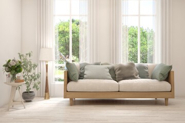 Minimalist living room in white color with sofa and summer landscape in window. Scandinavian interior design. 3D illustration