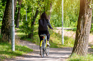 Cyclist ride on the bike path in the city Park
