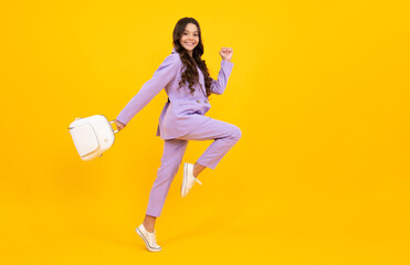 School teen with backpack. Teenager student, isolated background. Learning and knowledge. Go study. Education concept. Run and jump. Happy face, positive and smiling emotions of teenager girl.
