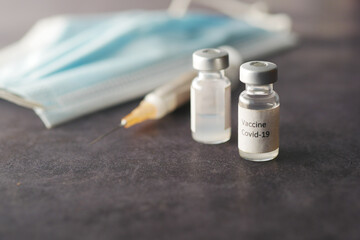 Close up of coronavirus vaccine and syringe 