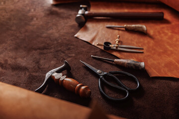 Natural leather brown color with tools, copy space. Concept banner background tailor shoes maker