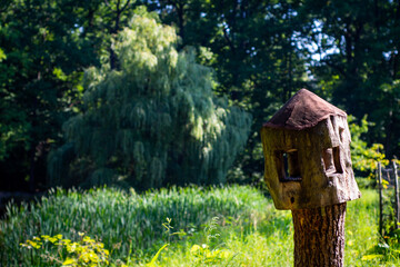 Birdhouse by a pond