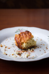 Fasting. An empty plate with crumbs of food. There is a piece of bread in the plate. Lack of food