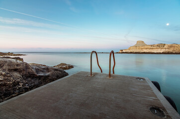 Typical stairs of the Island of Malta for easy access to the Mediterranean Sea, Gozo, Malta.