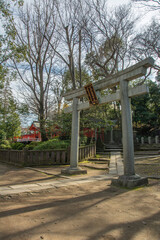 A stone myojin torii at one of the entrances at the 18th century Nezu Shrine located in the Bunkyo ward of Tokyo