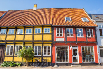 Fototapeta na wymiar Red and yellow half timbered houses in Ribe, Denmark