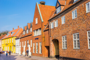 Fototapeta premium Red brick historic buildings in the central street of Ribe, Denmark