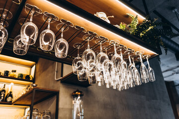 glasses hanging over the bar