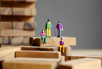 Miniature figurine character: two people sitting, two people standing on  pieces of wood games 