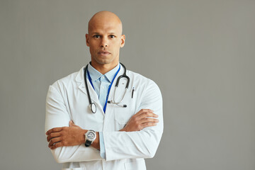 Studio portrait of confident black doctor looking at camera.