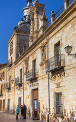 People in front of the historic town hall in Burgo de Osma, Spain