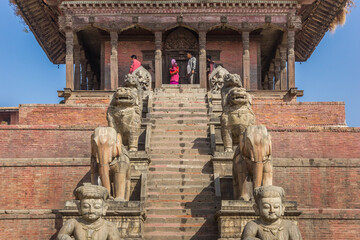 Stairs and sculptures at the Nyatapola temple on Durbar Square of Bhaktapur, Nepal