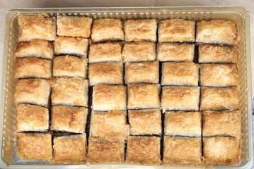 36 pieces of Baklava that is a layered pastry dessert made of filo pastry, filled with chopped nuts, and sweetened with syrup or honey