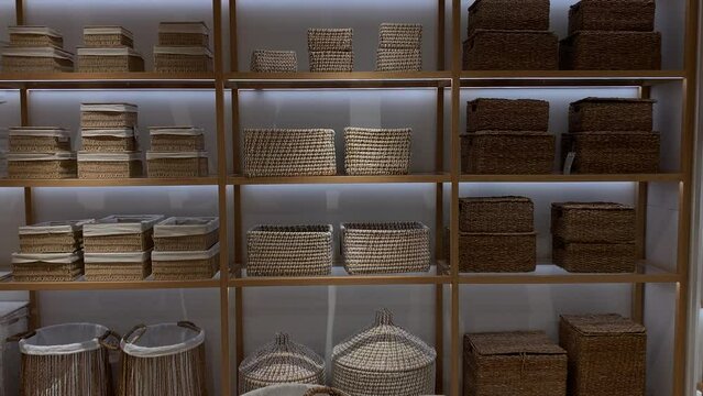 store shelves with wicker baskets close up. decor for house interior.