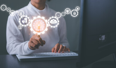 A young businesswoman is using a virtual monitor to store some important information,