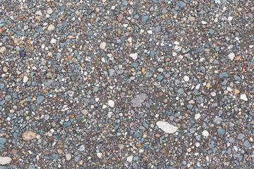 Granular abstract homogeneous granular surface. asphalt with crushed stone.