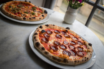 Roasted vegetable cheese and pepperoni pizza