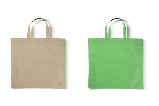 Blank green and beige non-woven bag mockup isolated on white background. eco friendly concept. 3d rendering.