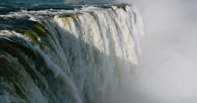Spectacular close-up aerial view of water gushing over the edge at the scenic Victoria falls. Unesco world heritage site