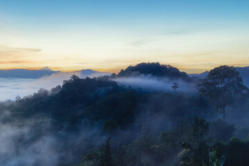 Fototapeta premium Beautiful flowing clouds and the mist in front of the mountains at Khao Khai Nui in sunrise time, Phang-Nga Province, Thailand