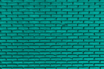 Fototapeta na wymiar Green color with an old grunge wall concrete texture as a background.