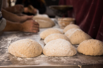 yeast dough in the form of loaves waiting to be cooked