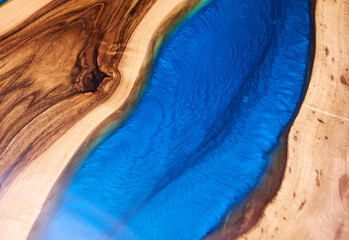 Texture of a wooden table with epoxy resin.
