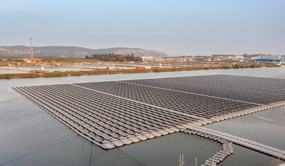 Solar farm panels in aerial view, rows array of polycrystalline silicon solar cells or...
