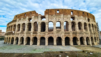 Panoramic view on exterior facade of famous Colosseum (Coloseo) of city of Rome, Lazio, Italy,...