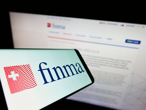 Stuttgart, Germany - 06-04-2022: Smartphone with logo of Eidgen&ouml;ssische Finanzmarktaufsicht (FINMA) on screen in front of website. Focus on center-left of phone display.