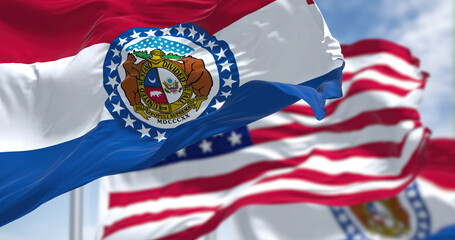 The Missouri state flag waving along with the national flag of the United States of America