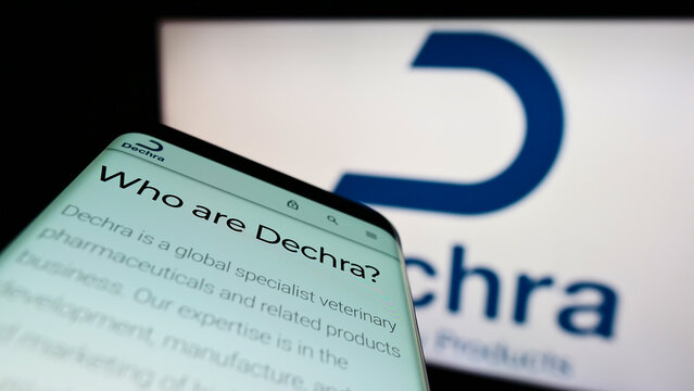 Stuttgart, Germany - 06-04-2022: Smartphone with webpage of British company Dechra Pharmaceuticals plc on screen in front of business logo. Focus on top-left of phone display.