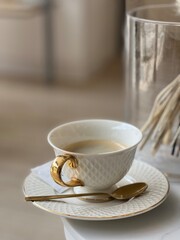 cup of coffee and golden spoon