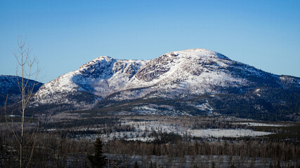 Dufour mountain in the horizon, snowy peaks at the end of the day, Charlevoix, Quebec, Canada