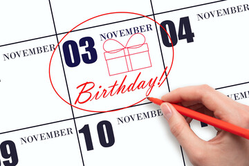 The hand circles the date on the calendar 3 November, draws a gift box and writes the text Birthday. Holiday.