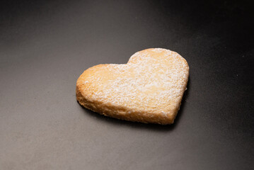 Shortbread in the shape of a heart isolated on white background.