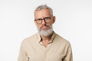 Fototapeta premium Closeup tired sad ill bored caucasian mature middle-aged man wants to sleep, feeling negative emotions, depression emotional burnout isolated in white background