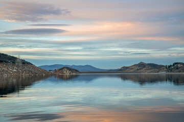 calm winter dusk over Horsetooth Reservoir in northern Colorado