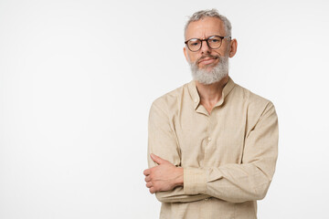 Sad offended disappointed caucasian mature middle-aged man in beige shirt and glasses feeling...
