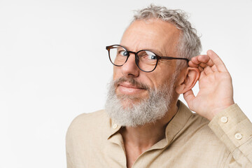 Closeup cropped curious mature middle-aged man pricking up ears, listening to gossips rumors, hand...