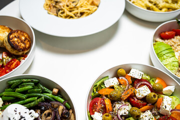 Set of festive meals of meat and vegetables and sweets on white background isolated. Menu set.