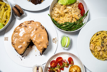 Set of festive meals of meat and vegetables and sweets on white background isolated. Menu set.