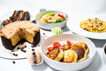 Set of festive meals of meat and vegetables and sweets on white background isolated. Menu set.