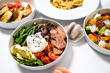 Set of festive meals of meat and vegetables and sweets on white background isolated. Menu set.