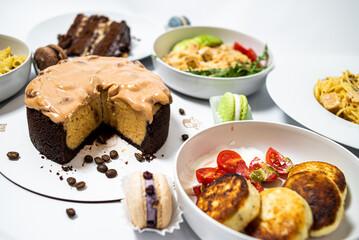 Set of festive meals of meat and vegetables and sweets on white background isolated. Menu set.